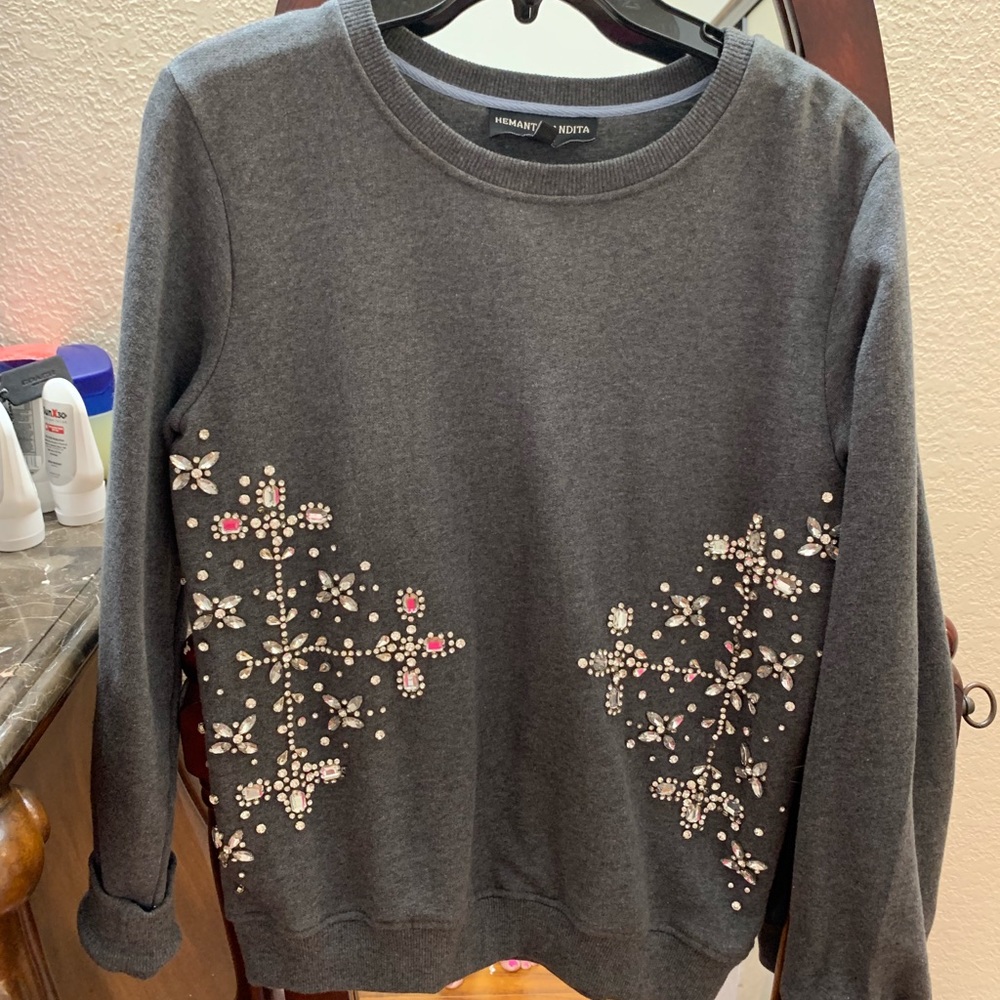 Women’s sweatshirt with beading details.